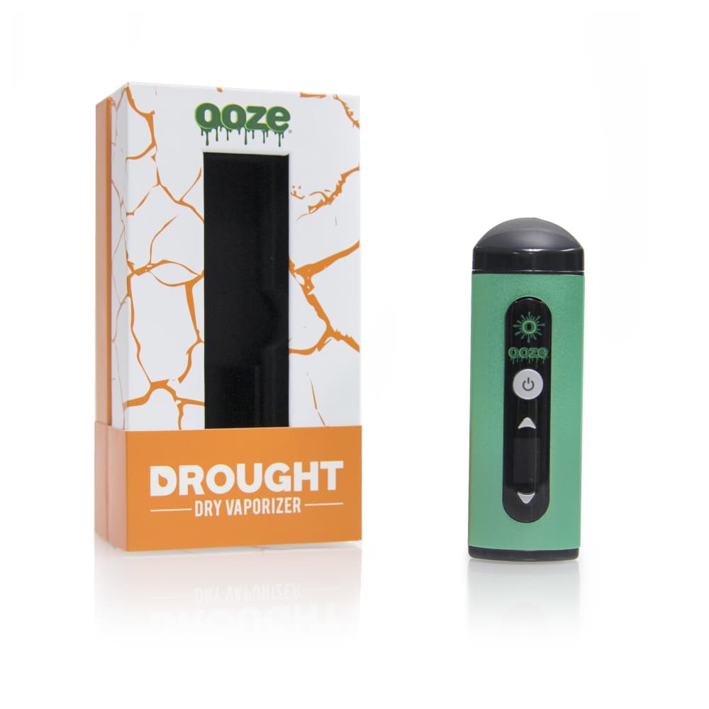 A front view of the Ooze Drought Dry Herb Vaporizer Kit, showing the device’s metallic finish next to its branded packaging.