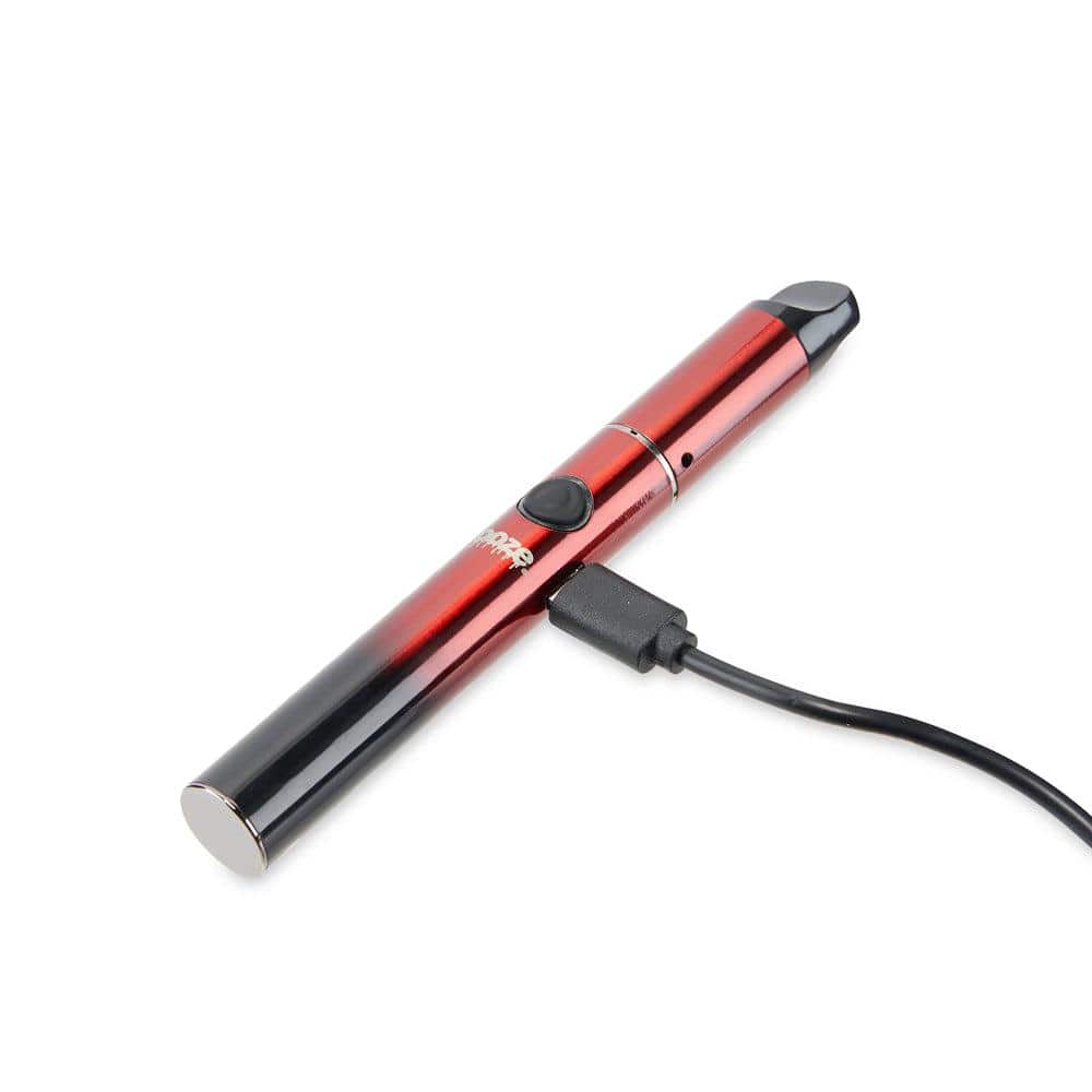 The Ooze Signal 650 mAh Concentrate Vaporizer Pen is shown in a close-up side view with a charging cable connected.