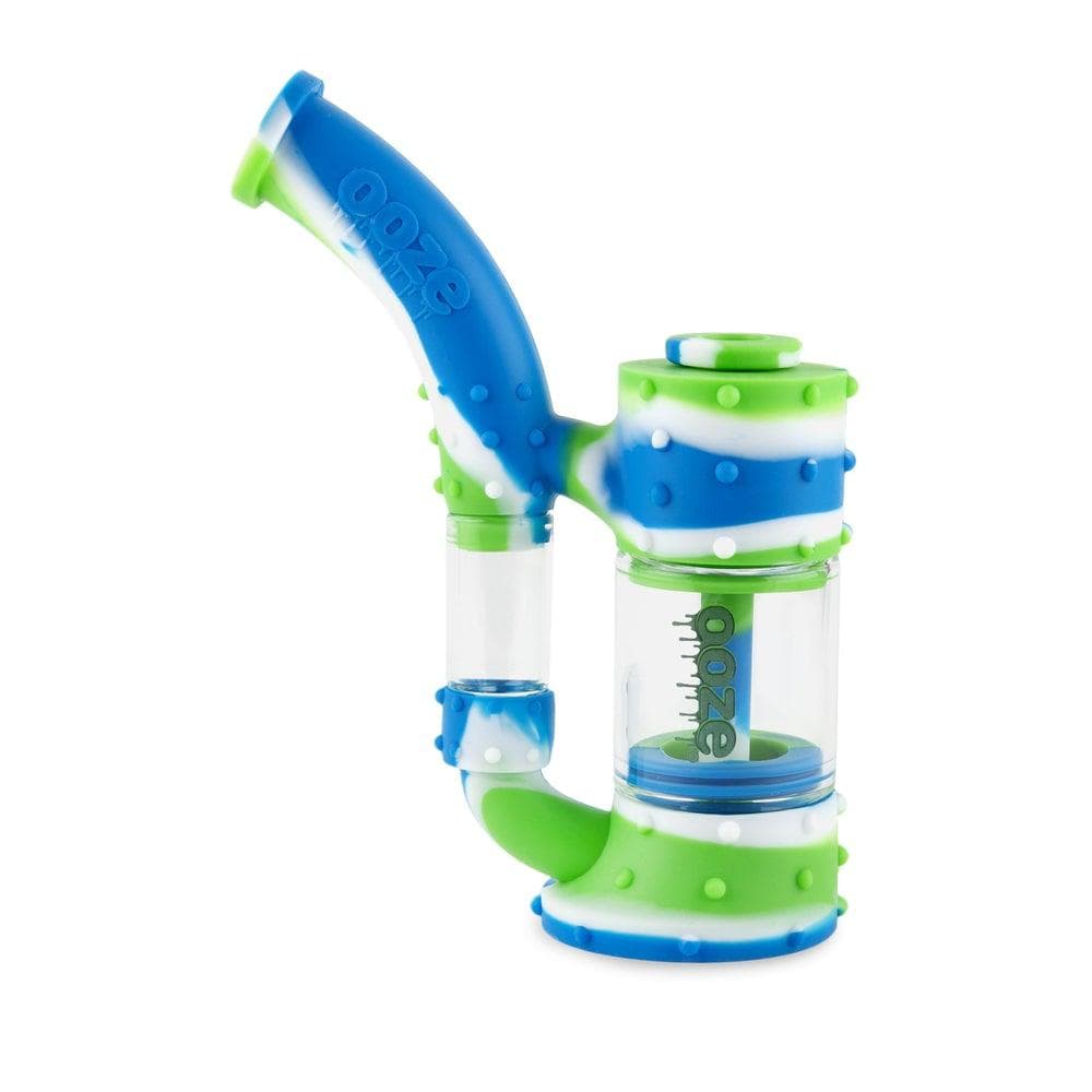 A close-up, angled view of the Ooze Stack Pipe Silicone Bubbler, showcasing its colorful, stacked design and clear glass chamber.