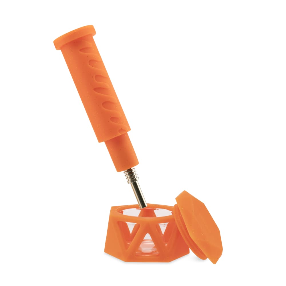 A slightly angled view of the Ooze Hyborg Silicone Glass 4-in-1 Hybrid Water Pipe and Nectar Collector, showing its clear glass and silicone components.