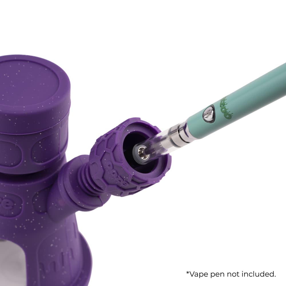 Close-up of the Ooze Hyborg Silicone Glass 4-in-1 Hybrid Water Pipe and Nectar Collector joint, showing the purple silicone grip.