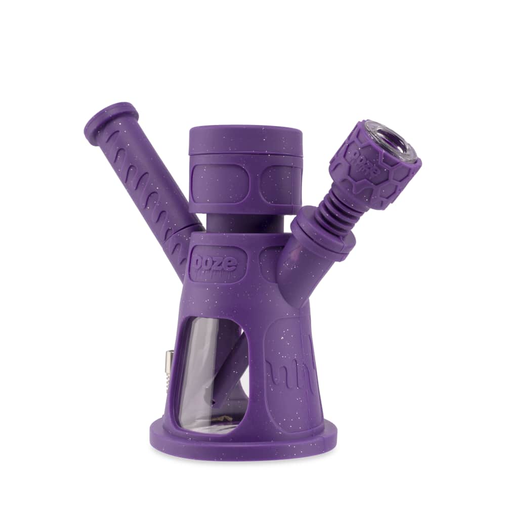 A three-quarter view of the Ooze Hyborg Silicone Glass 4-in-1 Hybrid Water Pipe and Nectar Collector, showcasing its purple and clear glass construction.