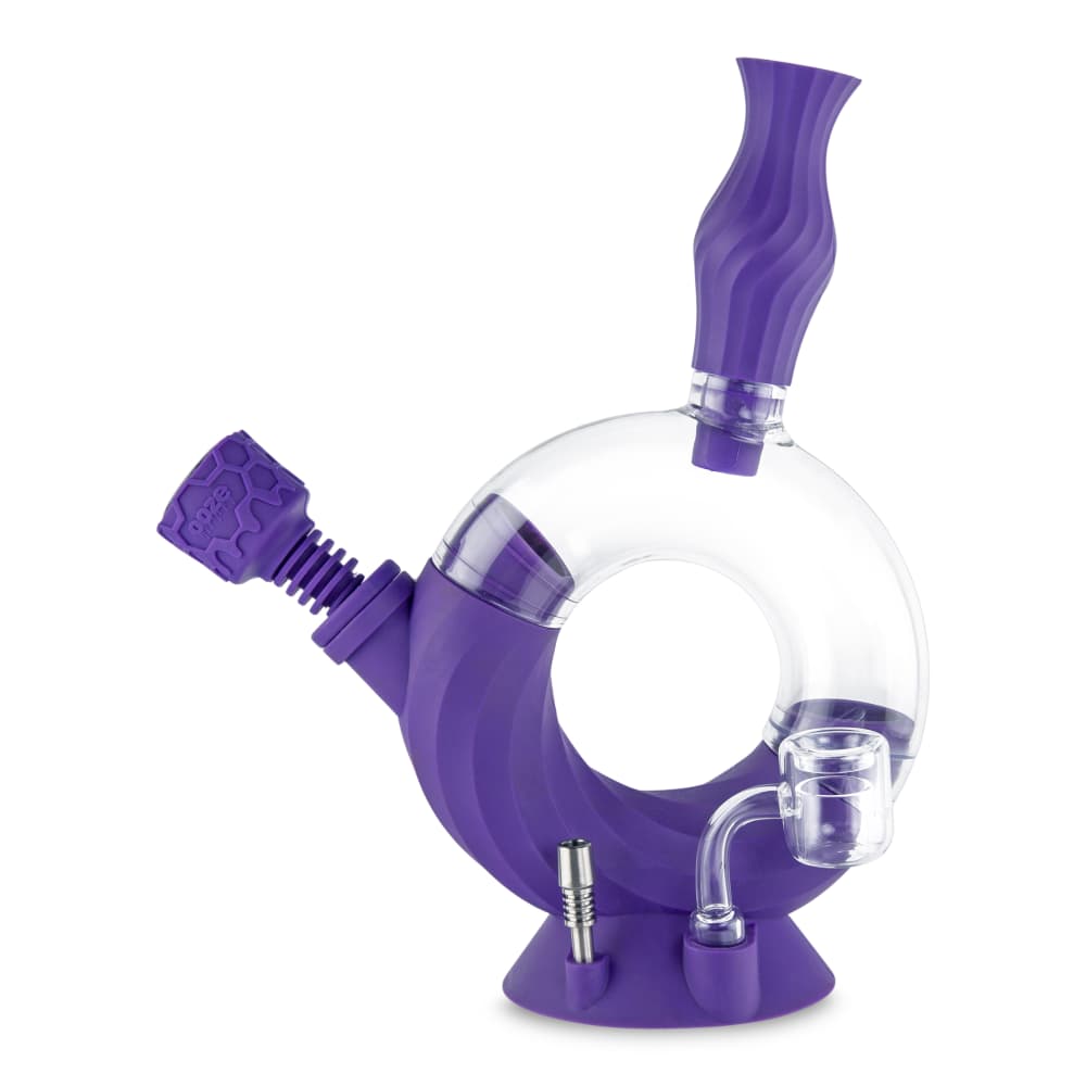 A studio shot of the Ooze Ozone Silicone Water Pipe and Dab Straw, angled to showcase its purple, curved design.