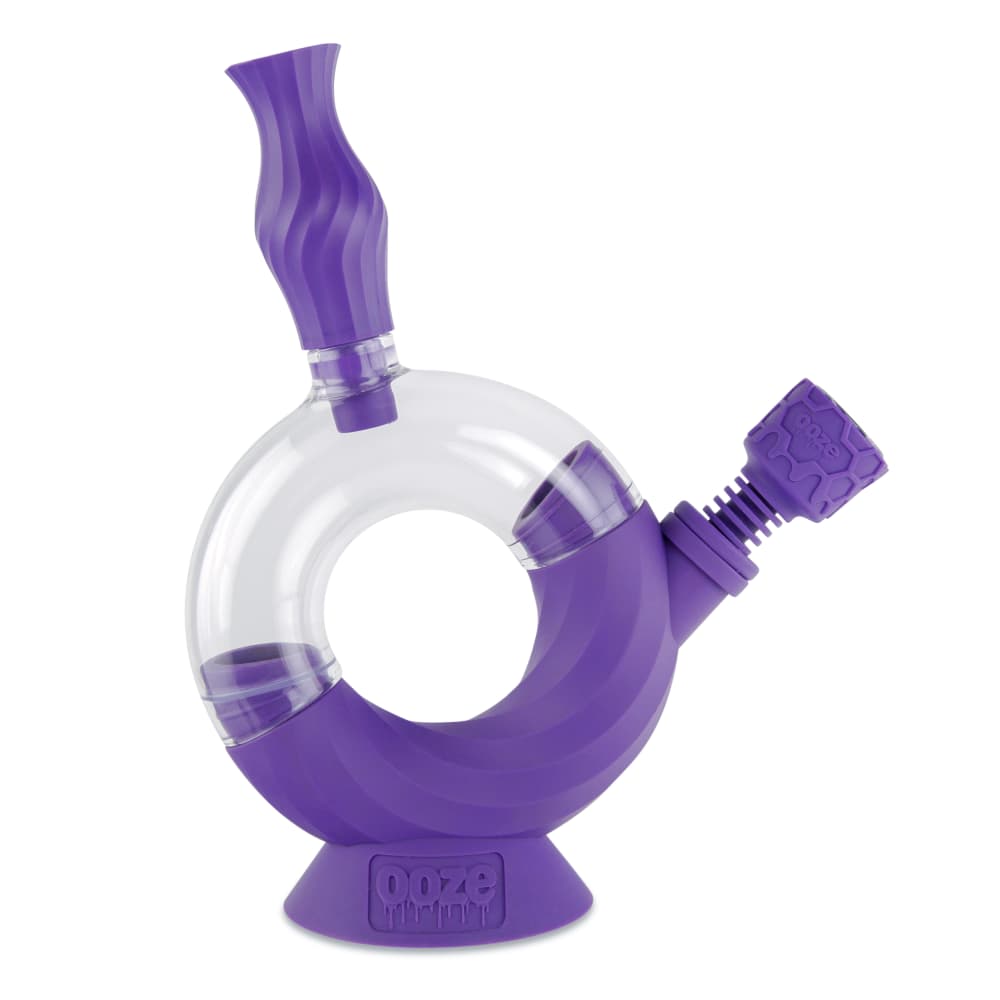A close-up, angled view of the Ooze Ozone Silicone Water Pipe and Dab Straw, showcasing its purple silicone construction.