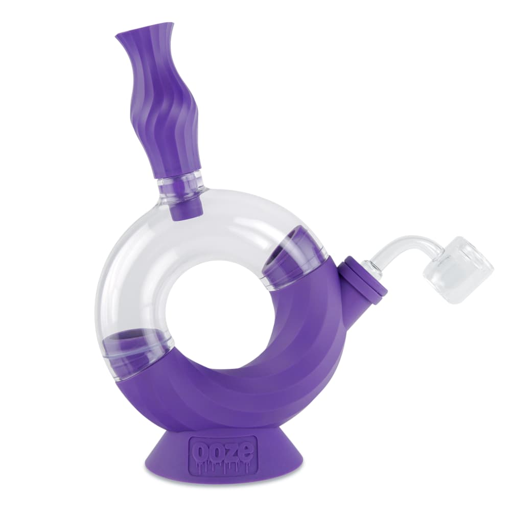 A front view of the Ooze Ozone Silicone Water Pipe and Dab Straw, showing a purple silicone pipe with a clear glass straw attachment.