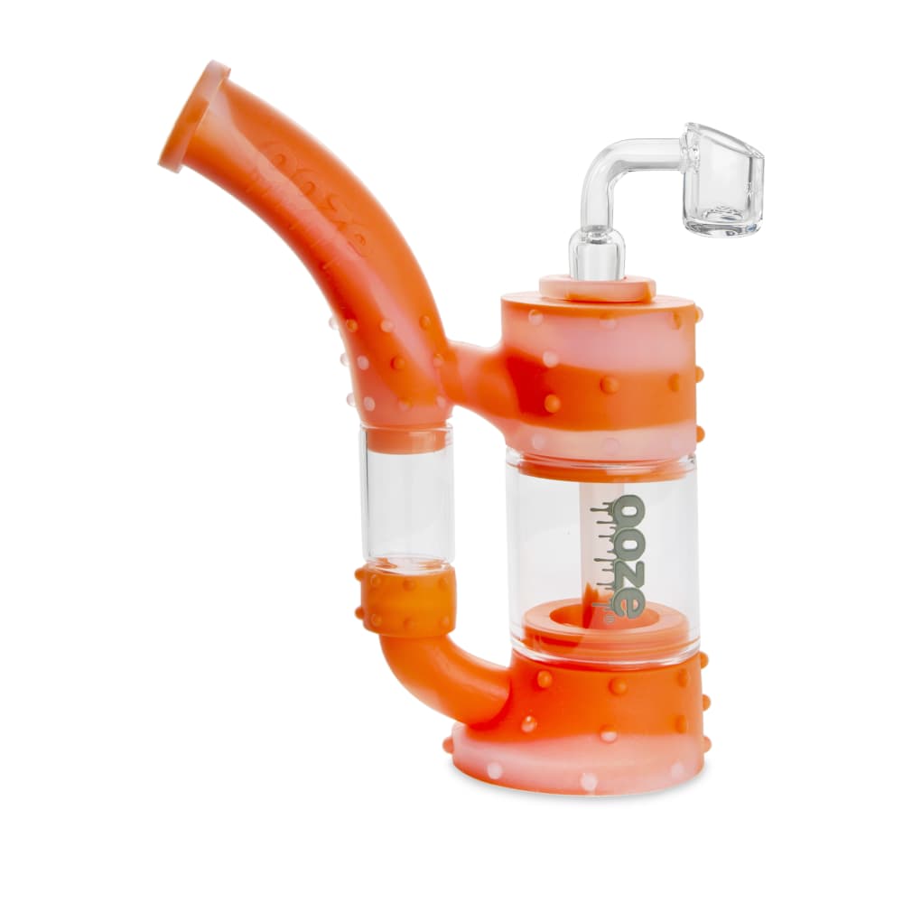 Front view of the Ooze Stack Pipe Silicone Bubbler, featuring a textured orange silicone body and clear glass mouthpiece.