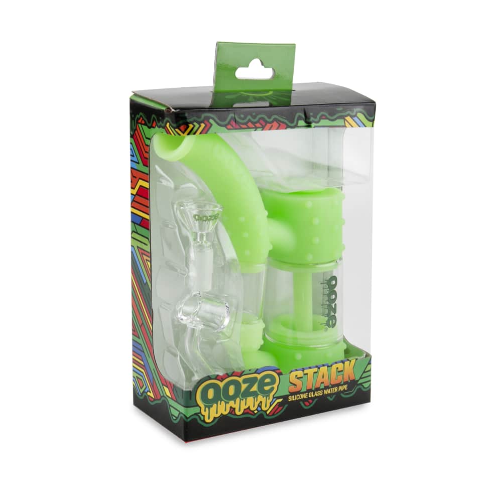 A front view of the Ooze Stack Pipe Silicone Bubbler, packaged in a colorful box with the product visible inside.