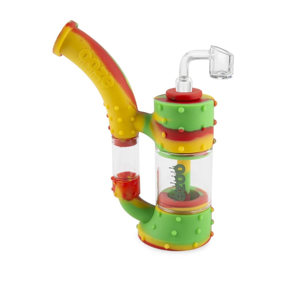 The Ooze Stack Pipe Silicone Bubbler is shown in a close-up, angled view with a green and clear design.