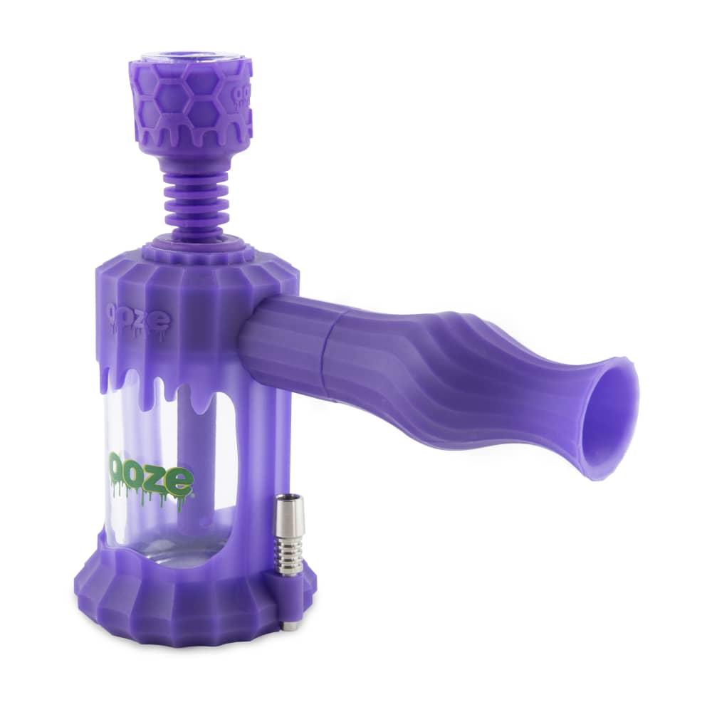 A studio shot of the Ooze Clobb Silicone Water Pipe and Dab Straw, angled slightly to highlight its purple, textured design.