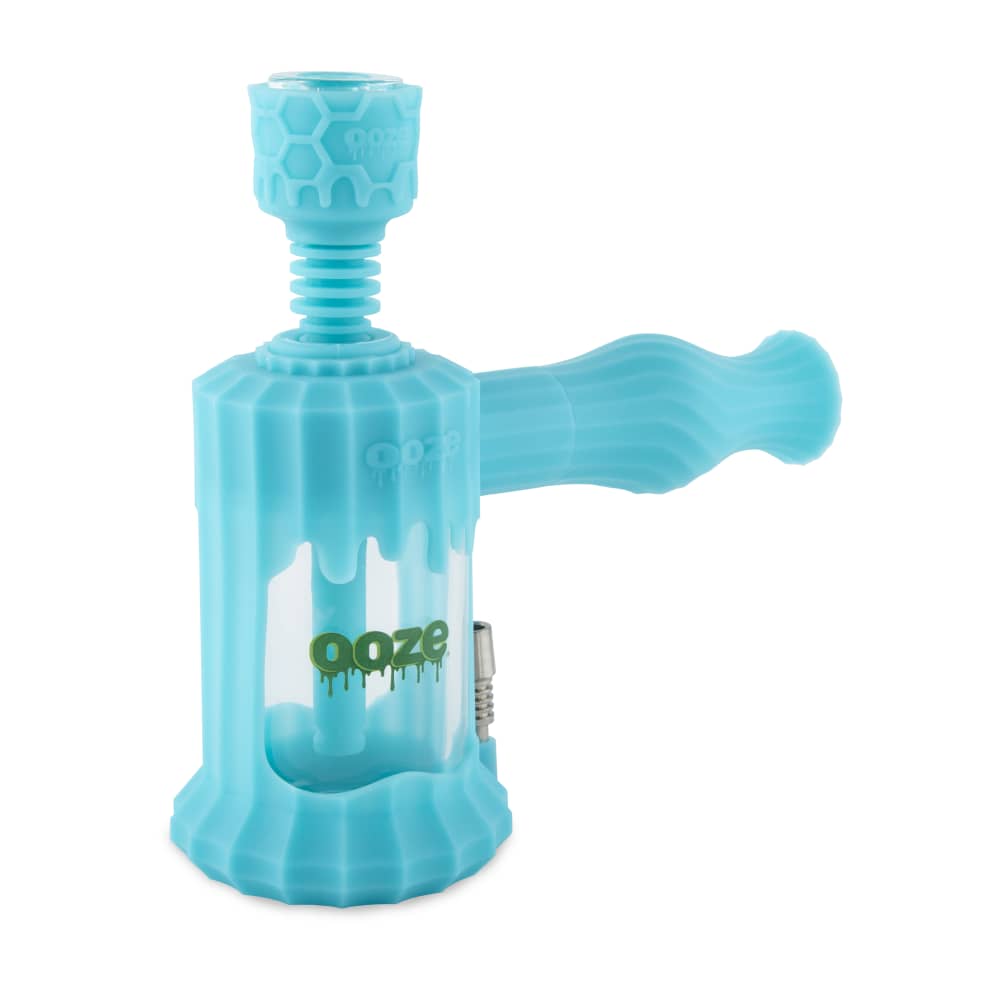 A studio shot of the Ooze Clobb Silicone Water Pipe and Dab Straw, showcasing its curved form and teal color against a plain white backdrop.
