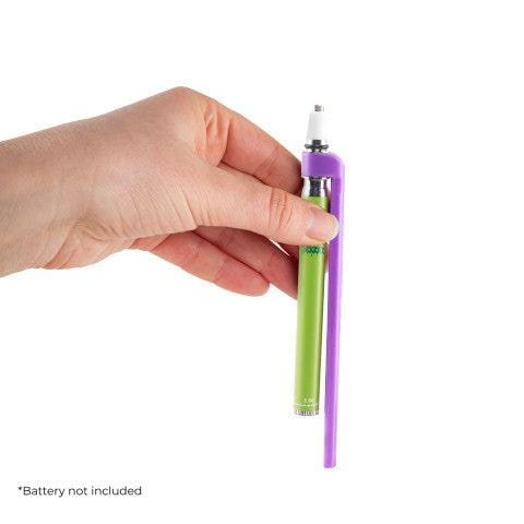 A hand holds the Ooze x Stache ConNectar 510 Thread Dab Straw Vape Pen Attachment, showcasing its sleek, elongated design.