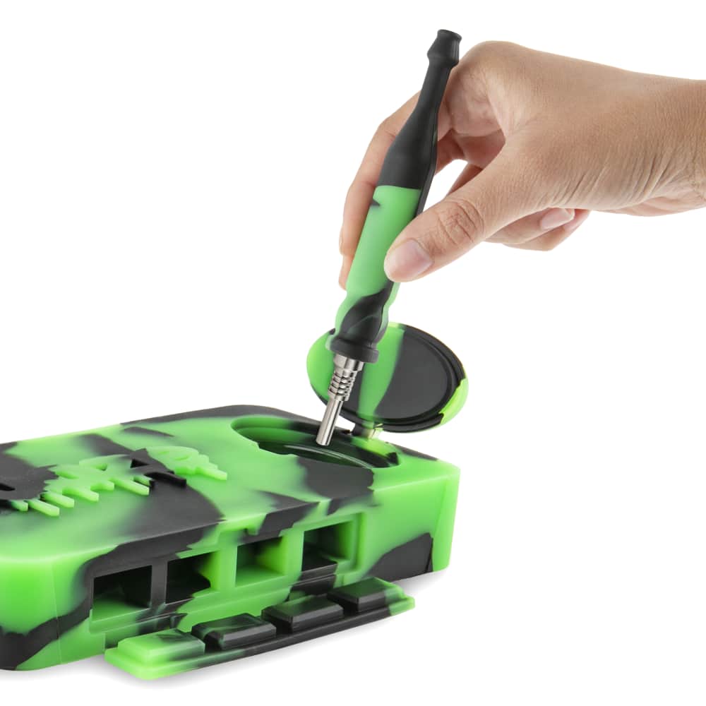 A hand opens the Ooze Slugger Silicone Dugout, revealing the dark interior of the one-piece container.