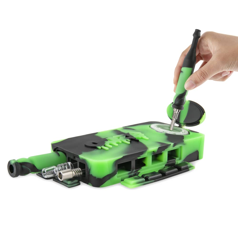 A hand opens the Ooze Slugger Silicone Dugout, revealing its interior against a neutral background.