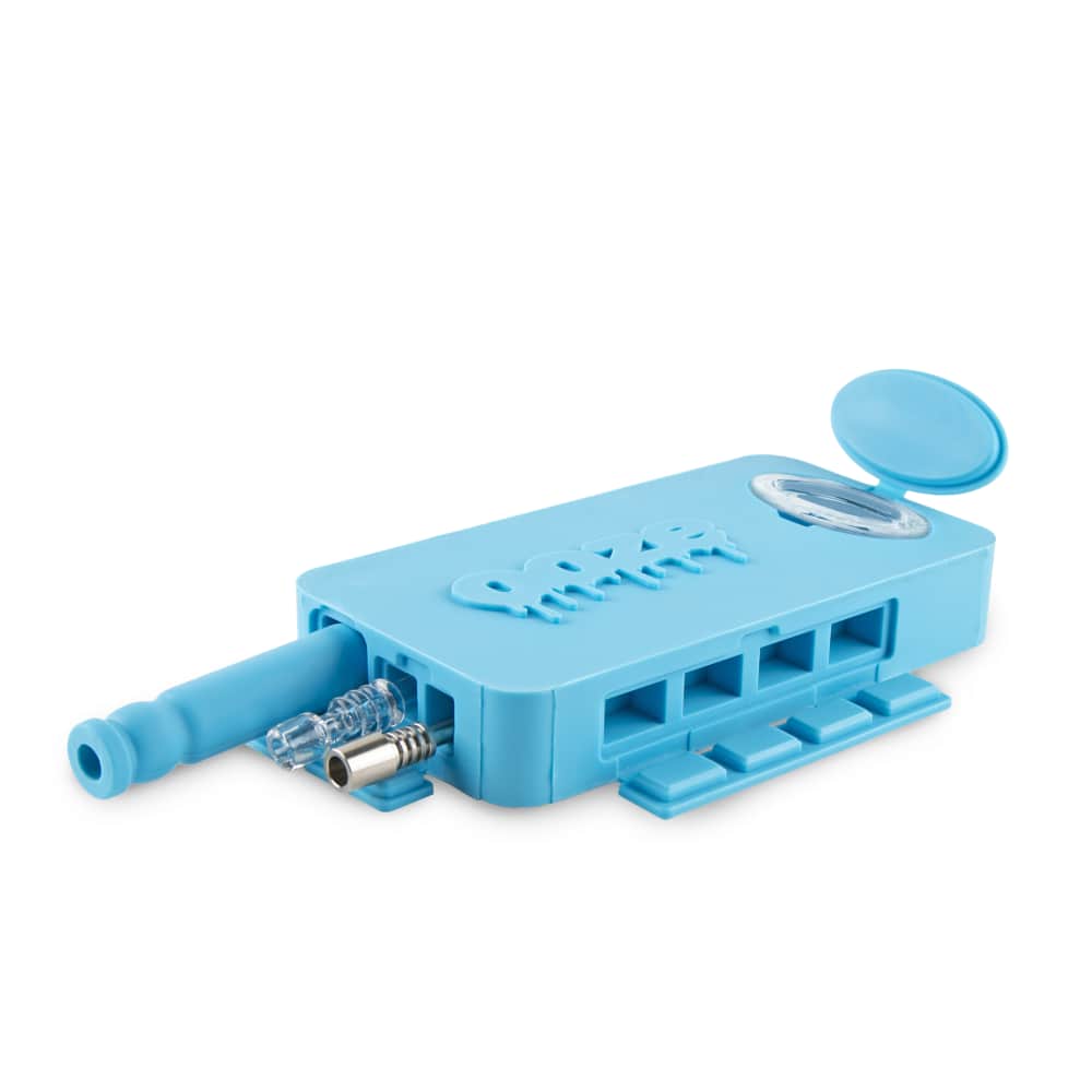 A top-down view of the Ooze Slugger Silicone Dugout, showing its open lid and internal compartment in a light blue tone.