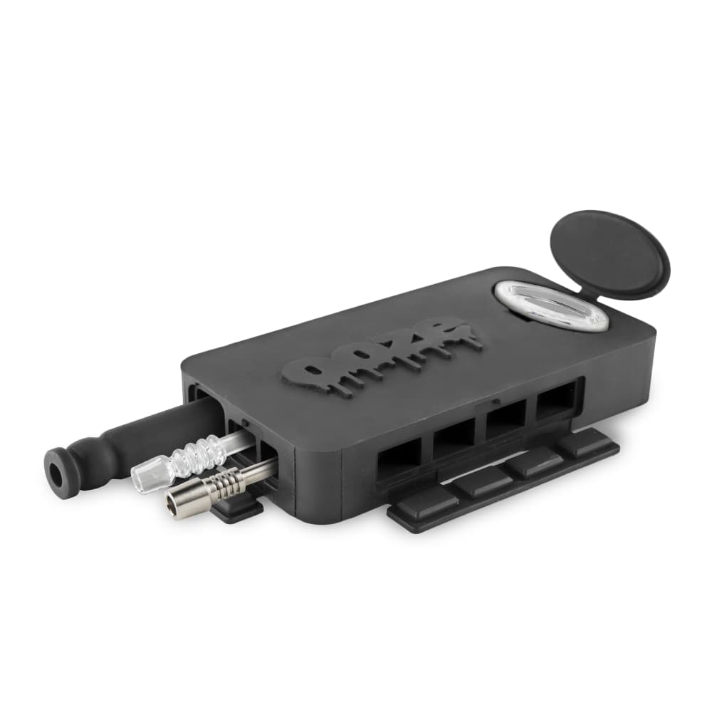 The Ooze Slugger Silicone Dugout is shown in a close-up, angled view with its lid open, revealing an internal compartment.