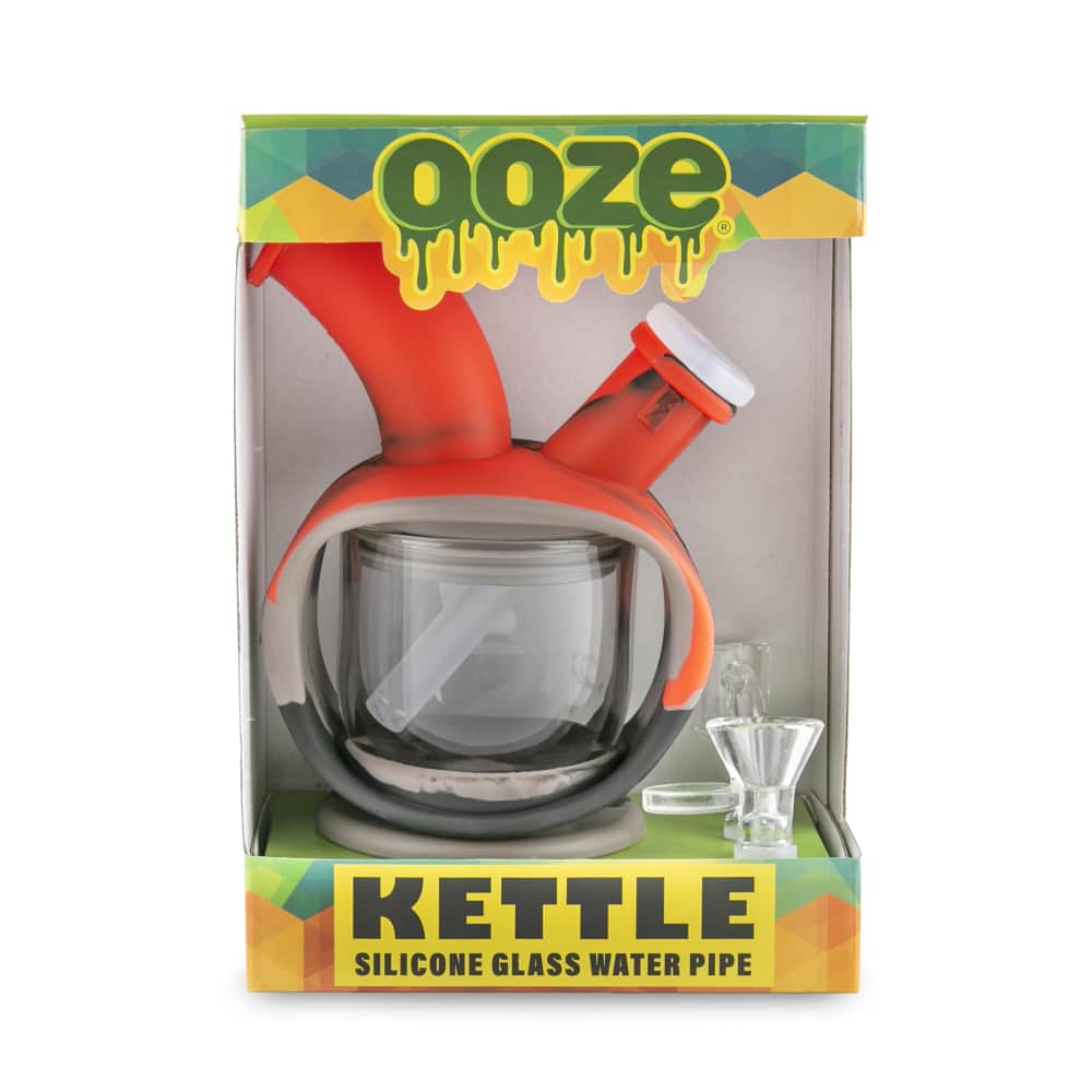 Front view of the Ooze Kettle Silicone Bubbler, a clear glass bubbler with a distinct rounded shape and branded packaging.