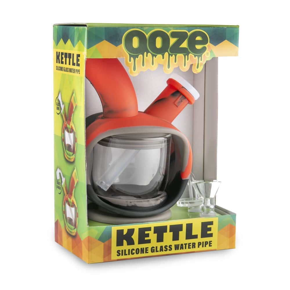 Front view of the Ooze Kettle Silicone Bubbler, showcasing its compact, clear design against a patterned background.