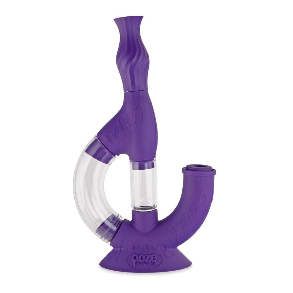 A studio shot of the Ooze Echo Silicone Water Pipe, showcasing its purple, curved form against a plain white background.
