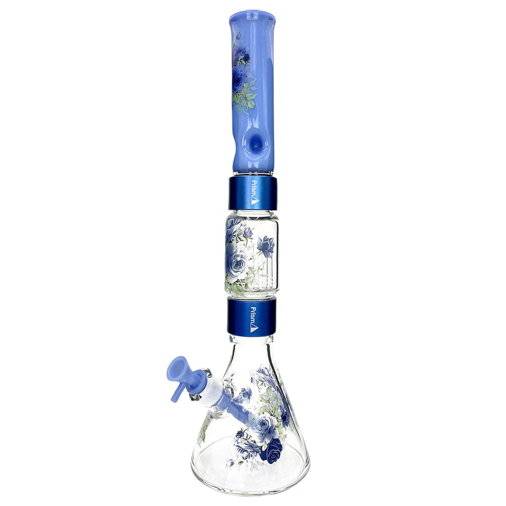 Straight-on studio view of the Prism Halo Moonlight Rose Beaker Double Stack showing blue floral decals on the mouthpiece, midstack chamber, and beaker base against a white background