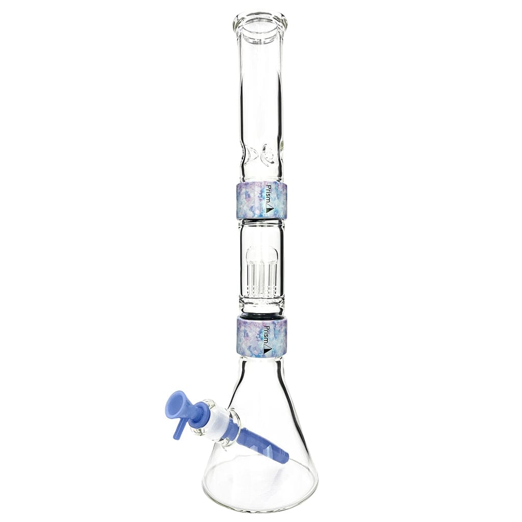 Straight-on view of the clear Prism Halo Tie Dye Beaker Double Stack showing two tie-dye accent rings and a blue downstem and bowl against a white background