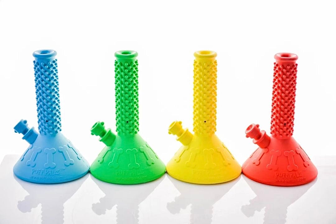 A front view of the Beaker Buddy, a clear glass beaker with a simple, classic design and reflective surface.