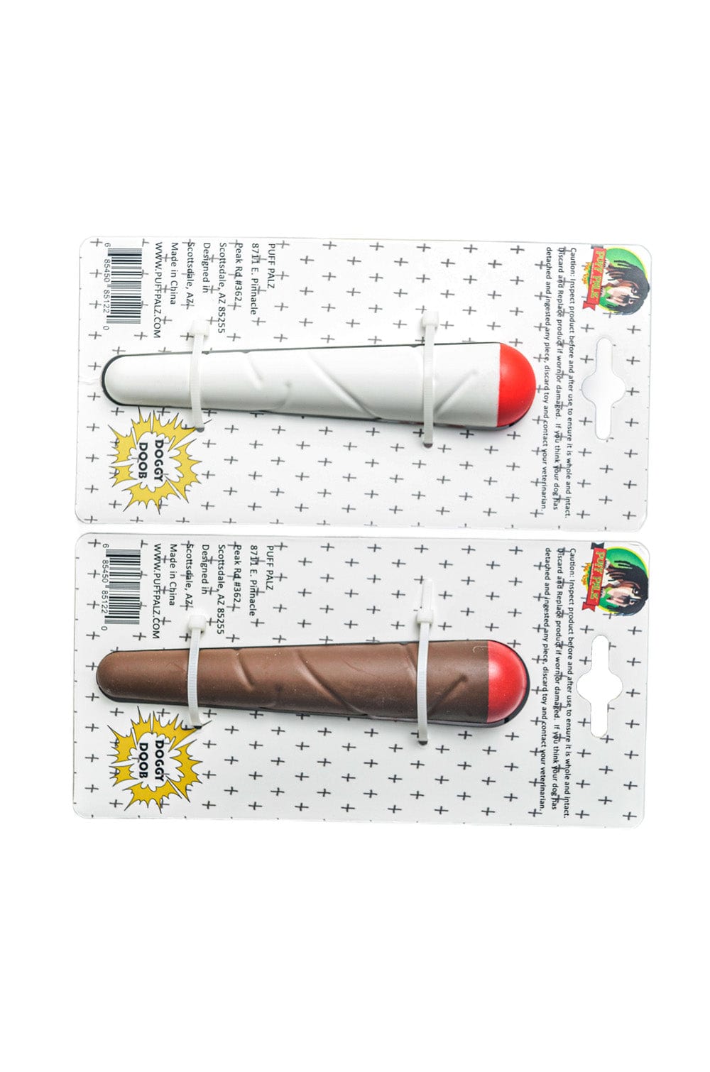 Top-down view of two packaged Doggie Doob toys—one white and one brown with red rounded tips—secured on patterned backing cards.