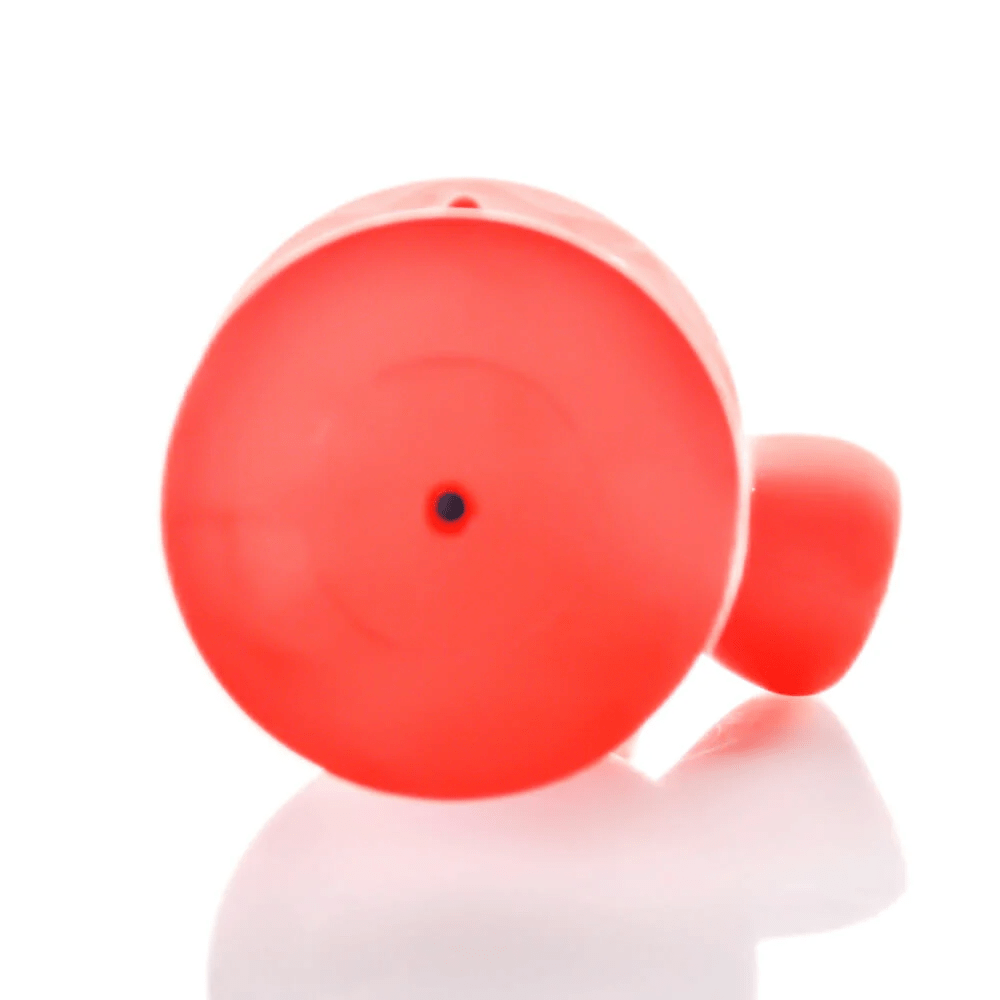 Close-up front view of the red Tug & Toke showing its circular end with a small central hole and soft shadow on a white background