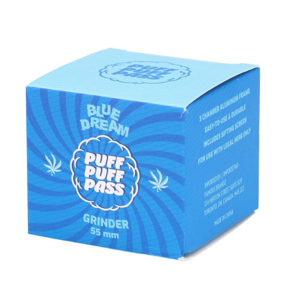 Three-quarter view of the blue Blue Dream 55mm 3 Stage Grinder retail box with spiral graphics and white logo text.