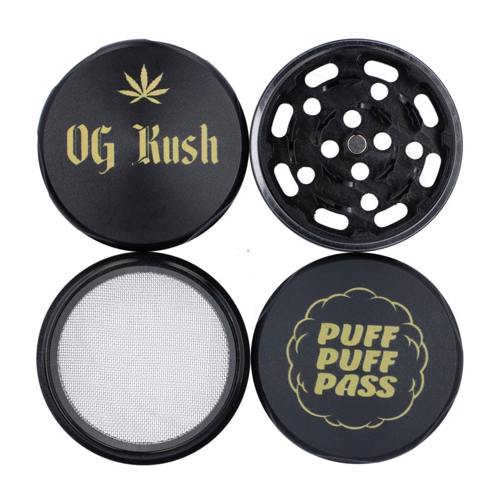 Top-down view of the four black metal pieces of the Puff Puff Pass OG Kush 55mm 3-Stage Grinder, two tops showing gold "OG Kush" leaf and "PUFF PUFF PASS" graphics and two internal sections with grinding holes and a fine mesh screen.