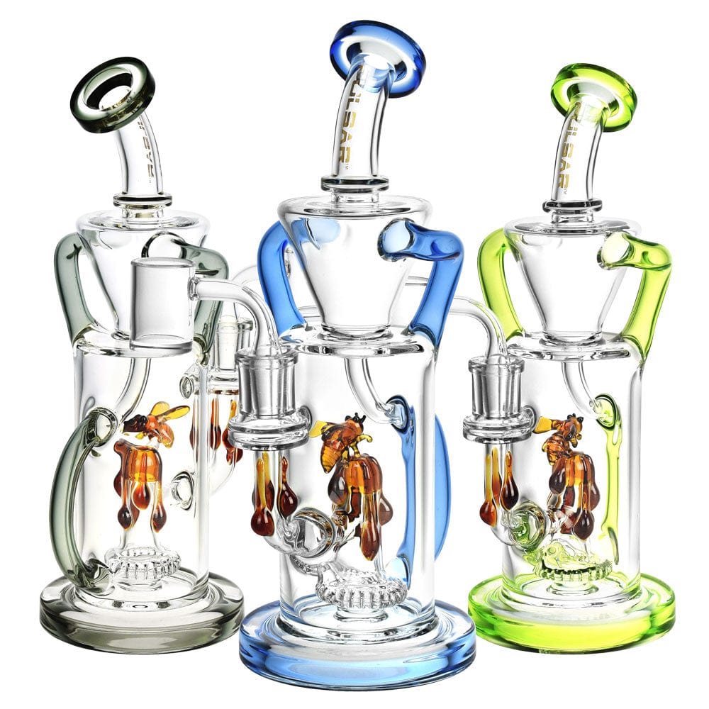 A front view of the Pulsar Honey Sweetness Recycler Dab Rig, showcasing its colorful glass and unique recycler design.