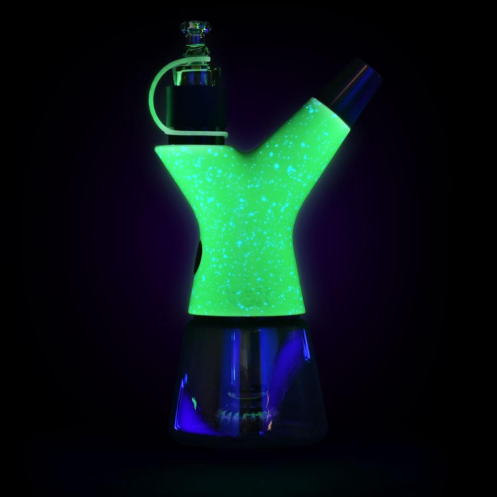 Front view of the glowing Luna Glow Pulsar RöK Electric Dab Rig, illuminated against a dark background.