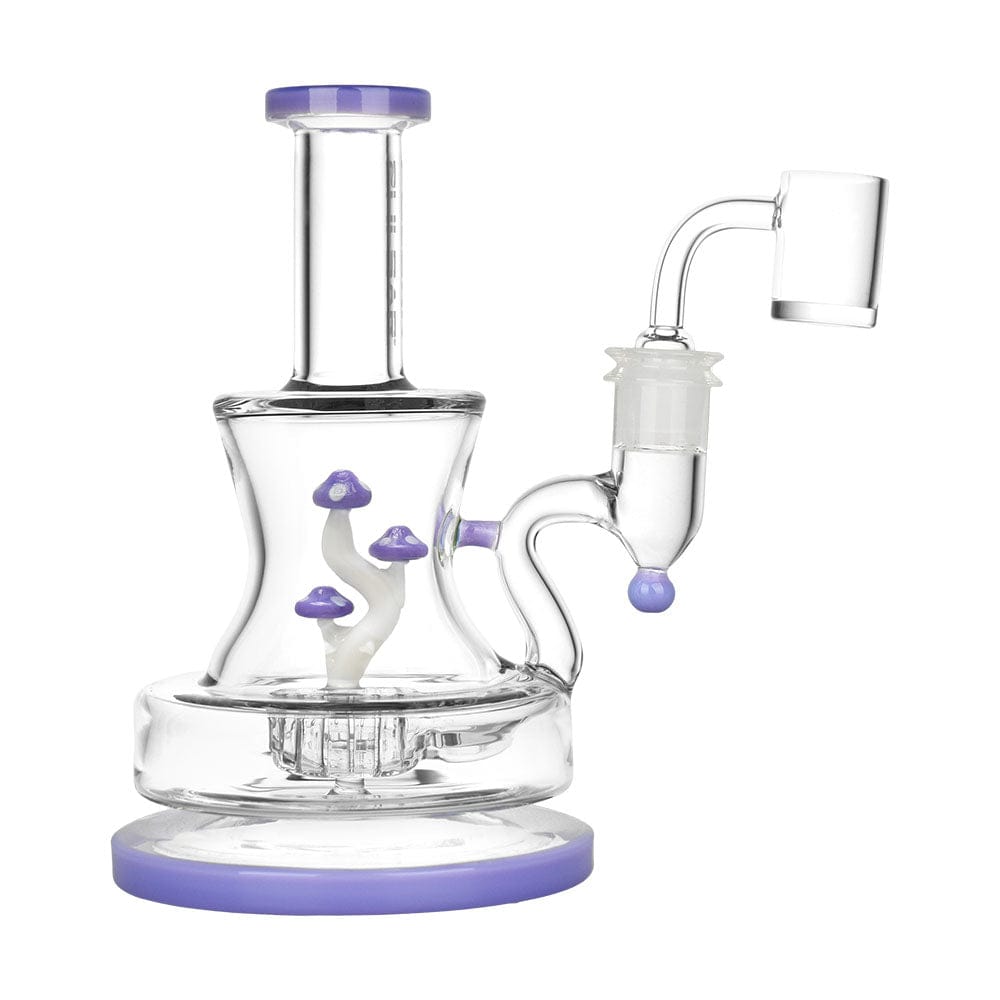 The Pulsar Shadow Lurking Shrooms Dab Rig is displayed in a side view, featuring mushroom-shaped accents on its clear glass body.