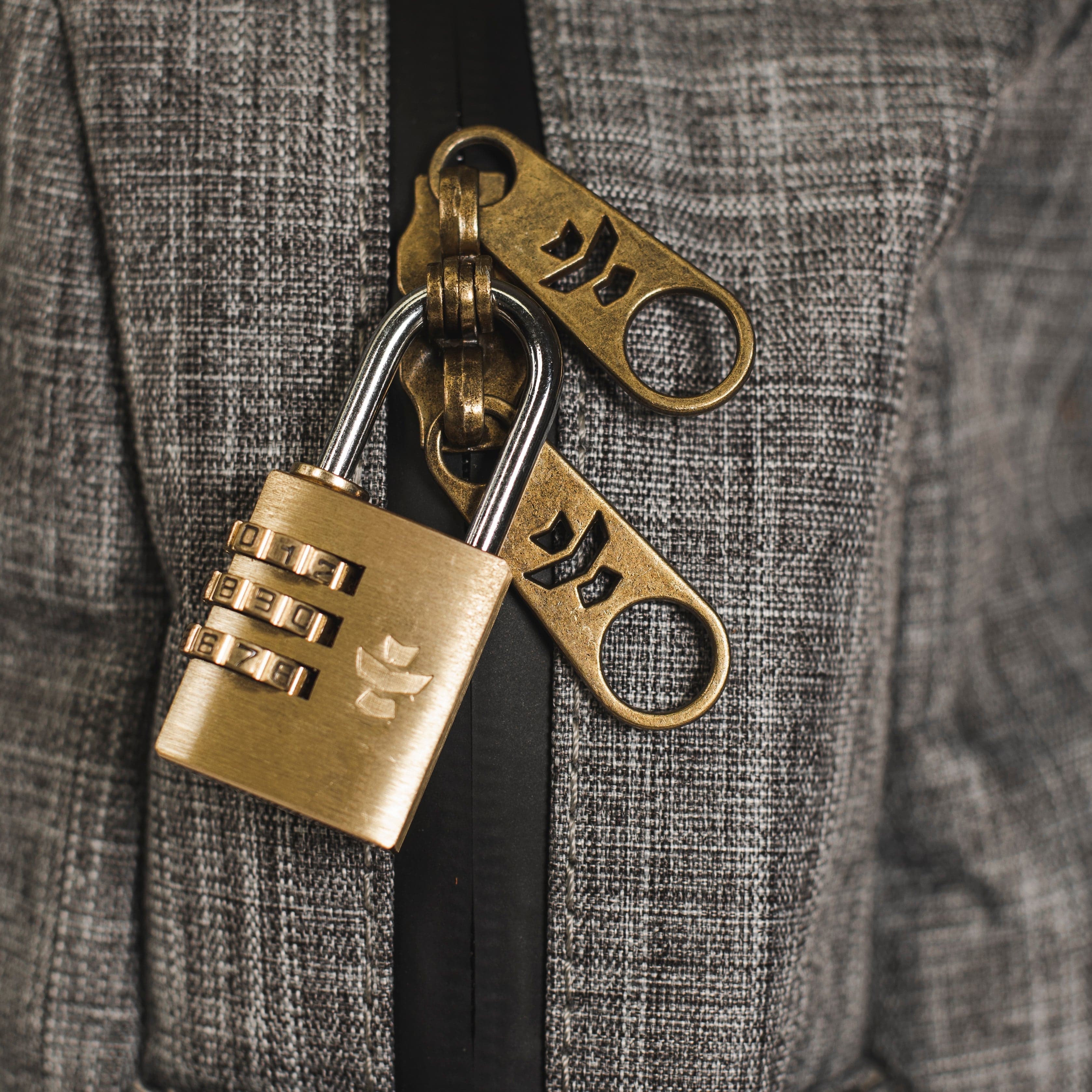 Close-up of The Explorer - Smell Proof Backpack zipper, highlighting the dark, textured fabric surrounding the metallic pull.