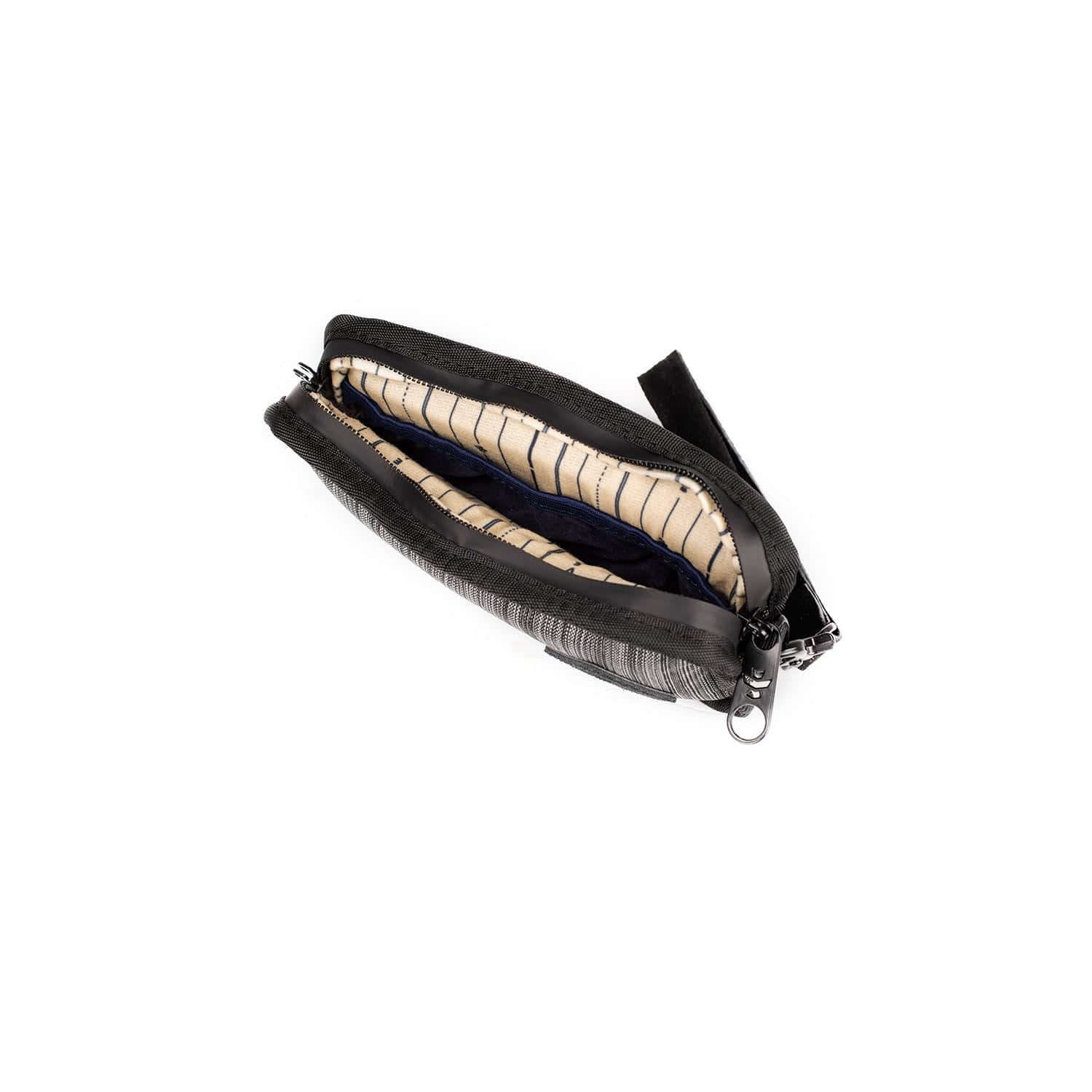 The Gordito - Smell Proof Padded Pouch is shown open, revealing a dark interior and padded construction from a slightly elevated angle.