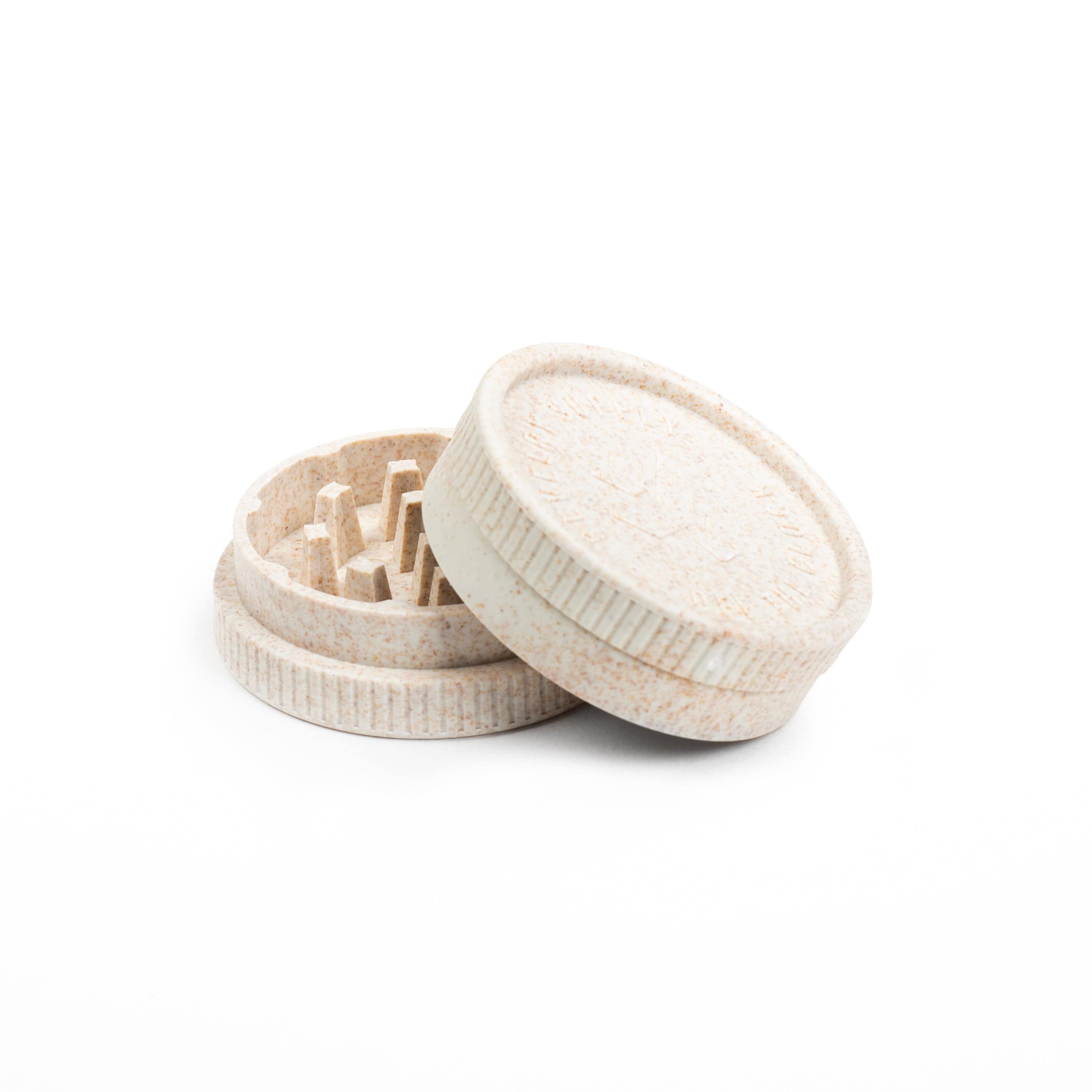 Top-down view of The Rolling Kit - Smell Proof Kit, featuring two closed, circular containers in a light color.