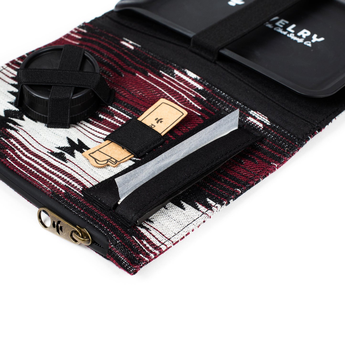 Close-up of The Rolling Kit - Smell Proof Kit, showcasing a patterned exterior with black accents in a top-down view.