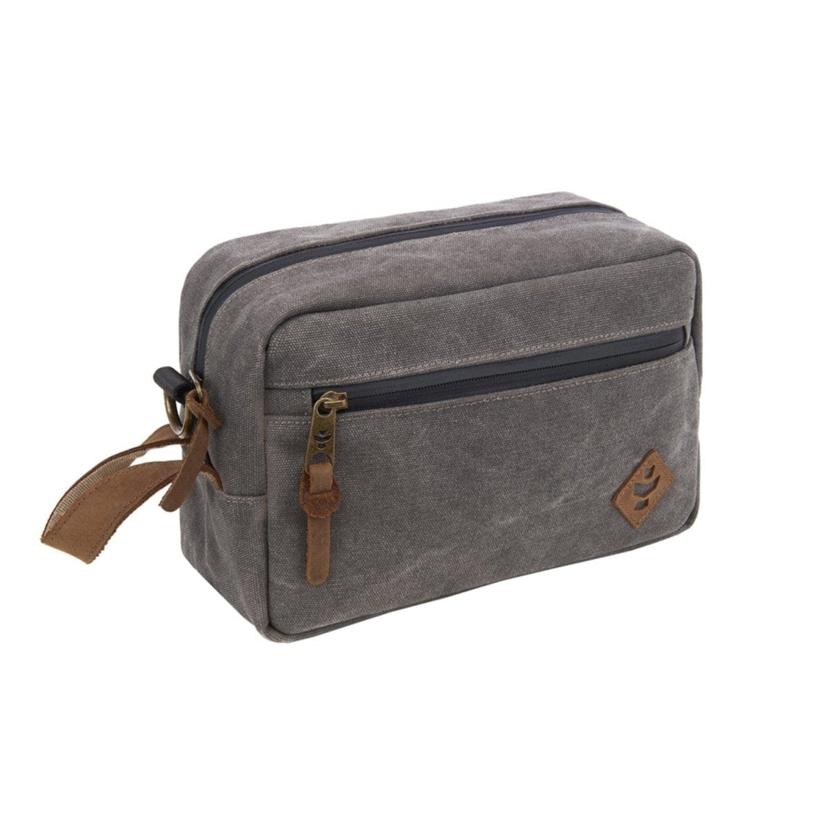 Front view of The Stowaway - Smell Proof Toiletry Kit, a dark gray zippered bag with a tan carry handle against a white backdrop.