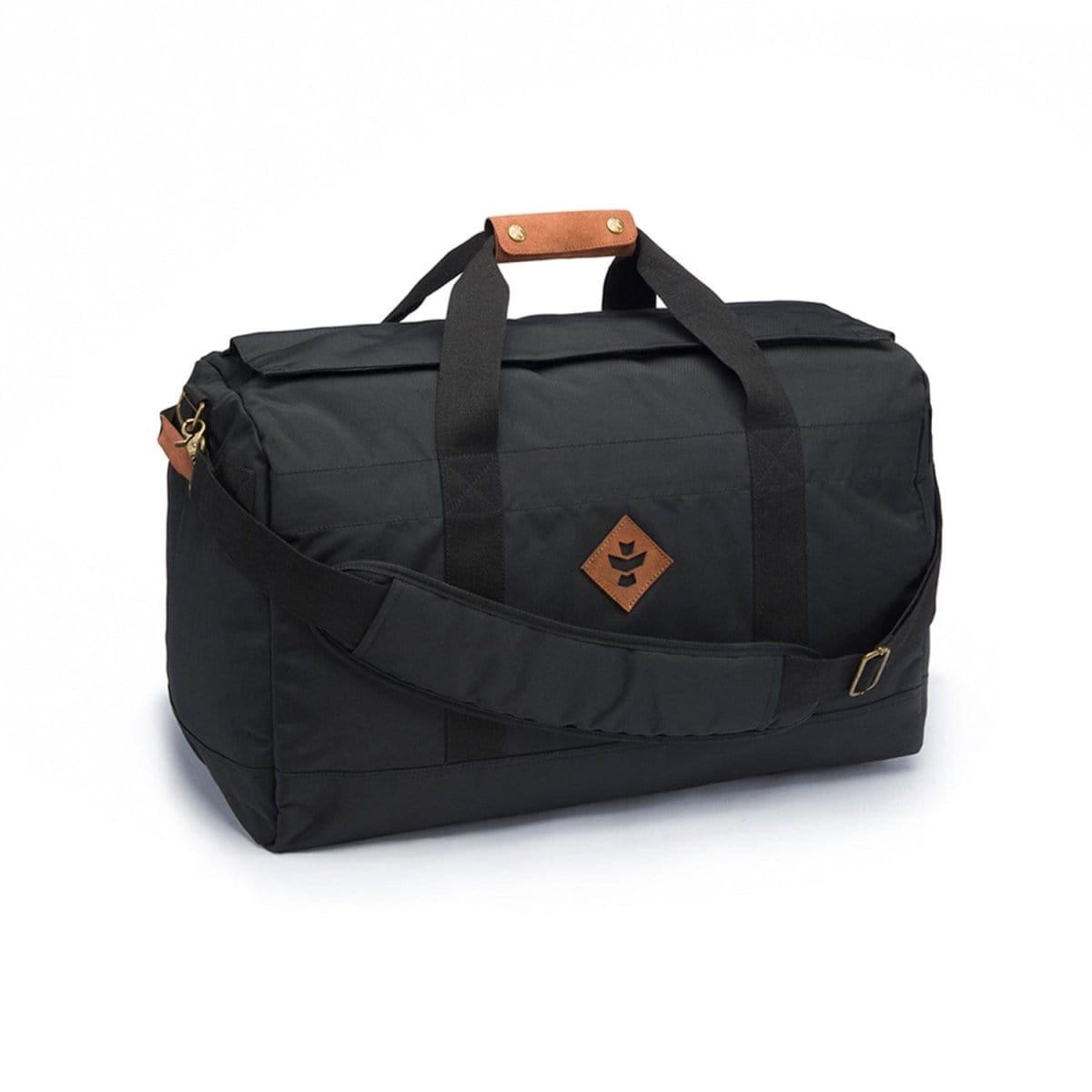 Three-quarter view of The Around-Towner - Smell Proof Medium Duffle in black resting on a white surface, showing top handles with a leather snap, a padded shoulder strap, and a small tan leather logo patch.