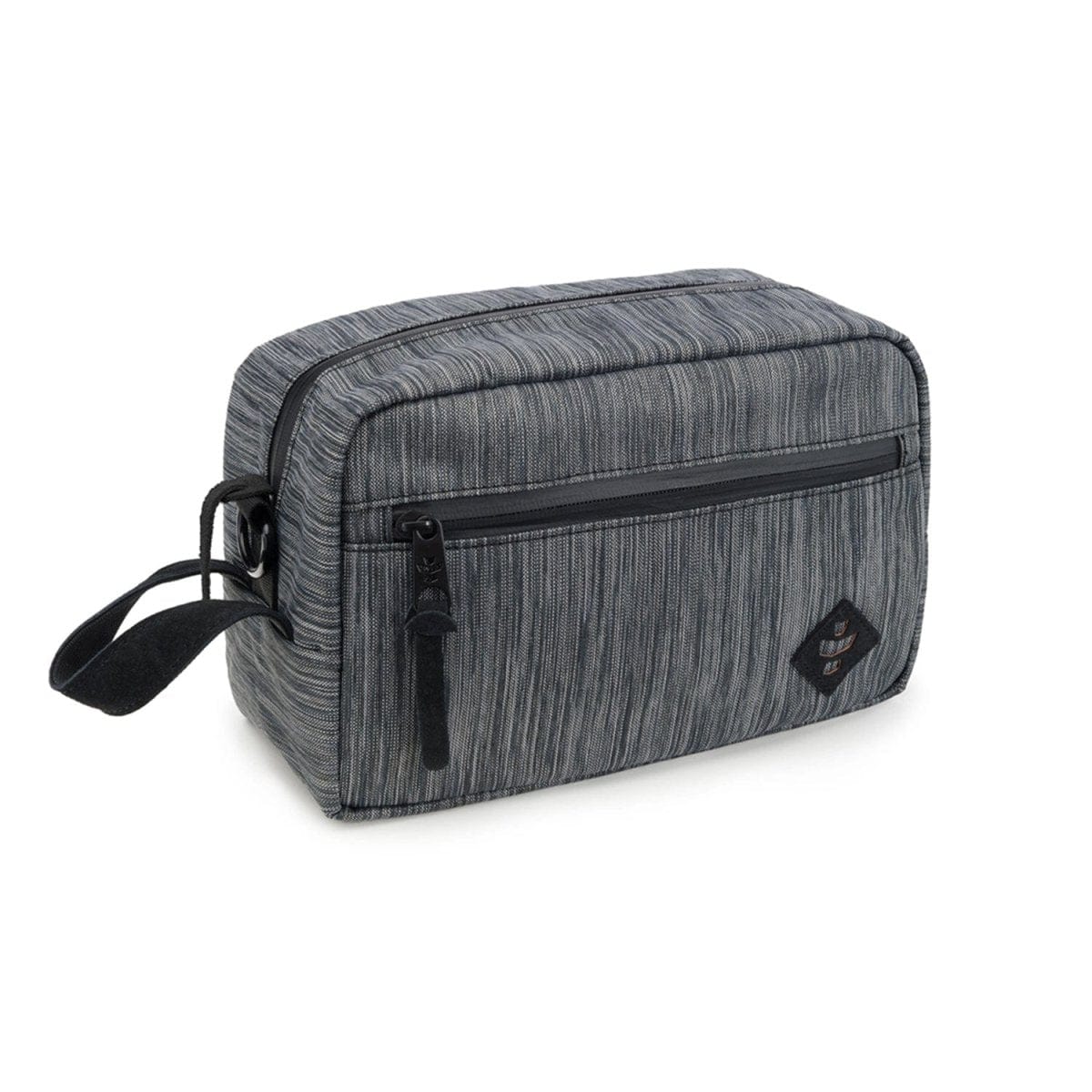 A slightly angled view of The Stowaway - Smell Proof Toiletry Kit, featuring a dark gray, zippered bag with a carrying handle.