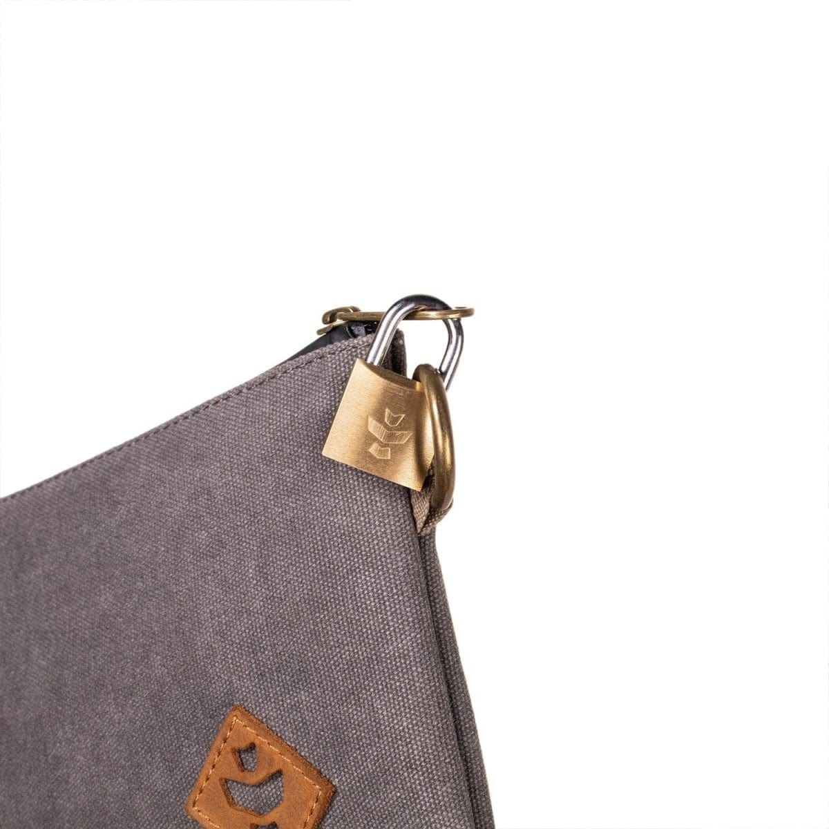 Close-up of The Broker - Smell Proof Zippered Stash Bag, showing the dark gray zippered closure and metallic pull tab.