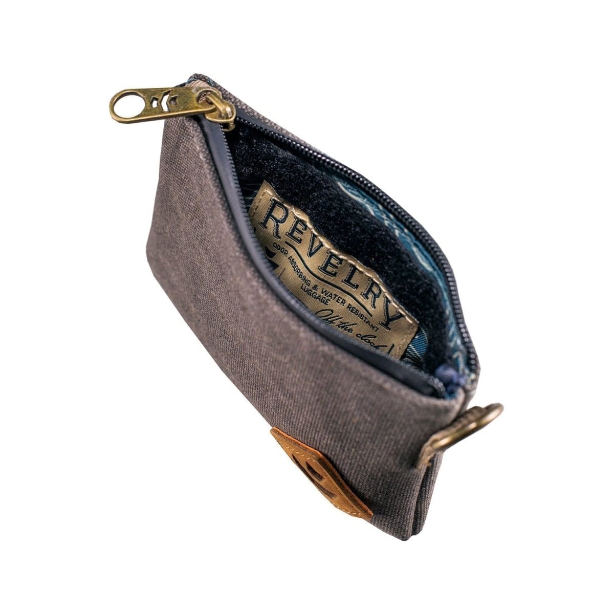 The Mini Broker - Smell Proof Zippered Small Stash Bag is shown in a slightly angled overhead view, featuring a dark-colored zippered closure.
