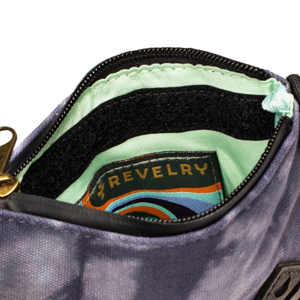 Interior view of The Mini Broker - Smell Proof Zippered Small Stash Bag, showcasing a vibrant, patterned lining inside the zippered pouch.