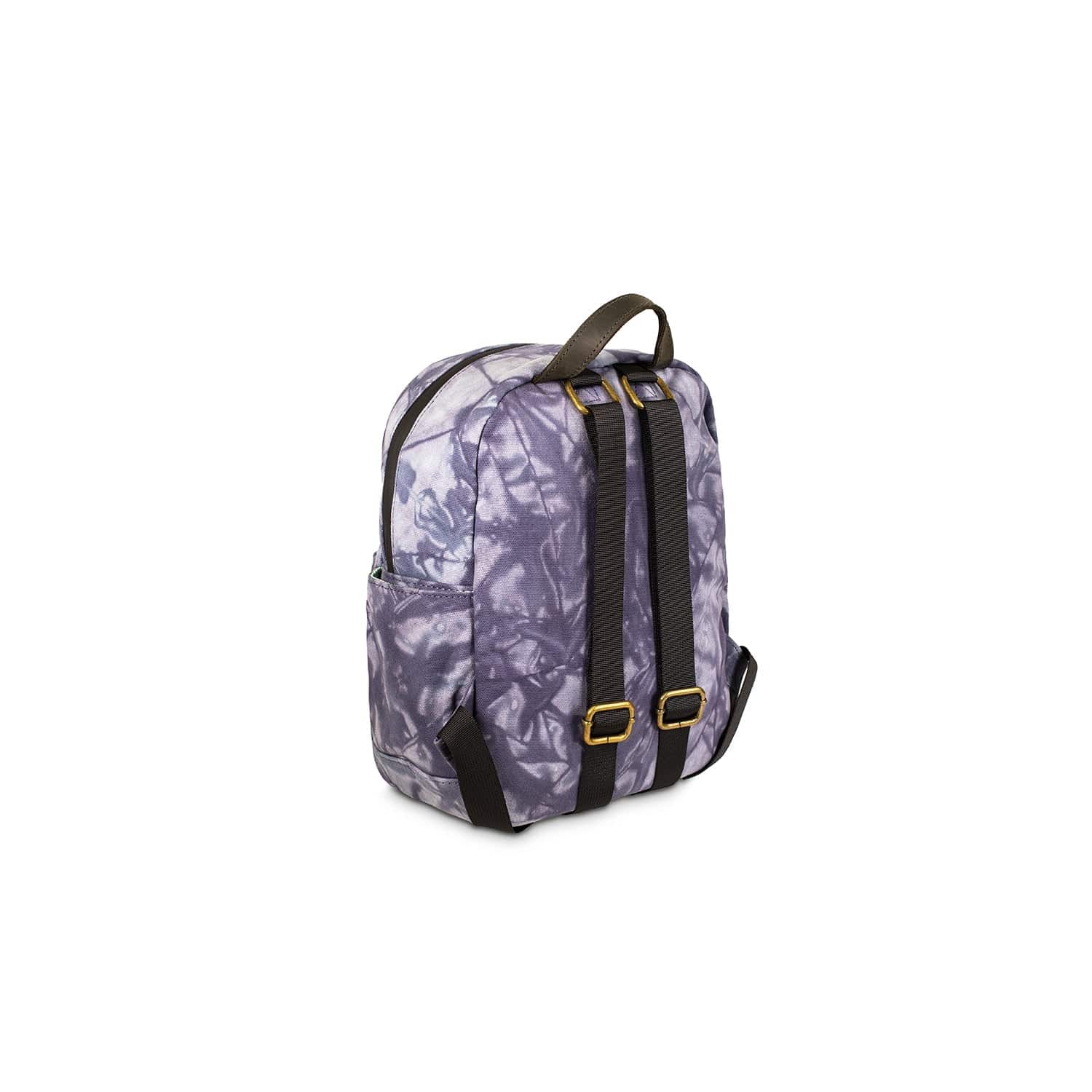 A three-quarter view of The Shorty - Smell Proof Mini Backpack, featuring dark straps against a patterned purple and gray surface.