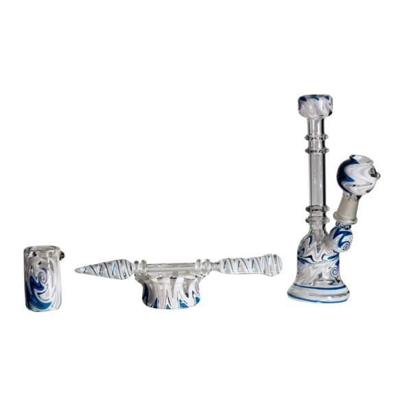 A side view of the 7-inch Glass Knucks with Dabber and Bowl, displaying its clear glass construction and included accessories.