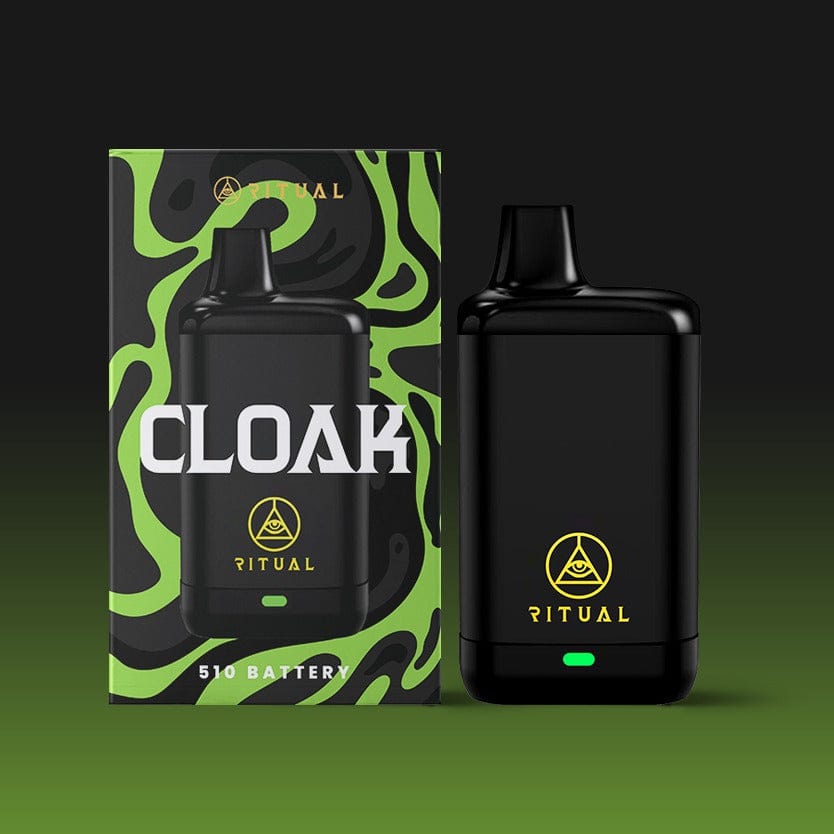 A front view of the black Ritual - Cloak 510 Variable Voltage Concealed Battery against a vibrant green, swirling background.
