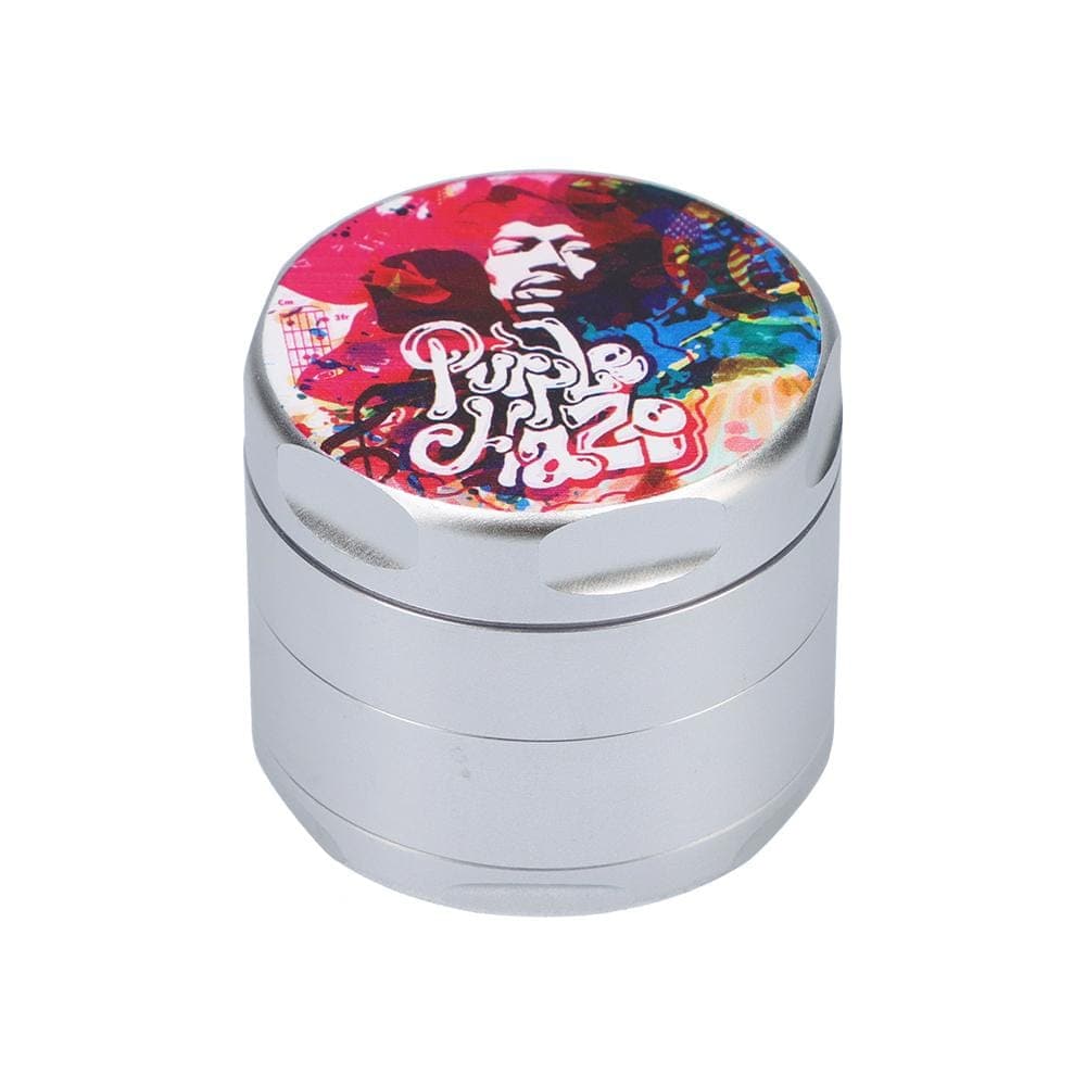 Front view of the Jimi Hendrix Rainbow Haze 55mm 4-Piece Grinder, a metallic, cylindrical grinder with a patterned top.