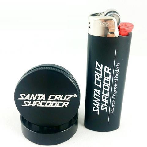 Close-up of the Santa Cruz Shredder 2 Piece Mini Grinder, showcasing its sleek, dark finish and two-piece design.