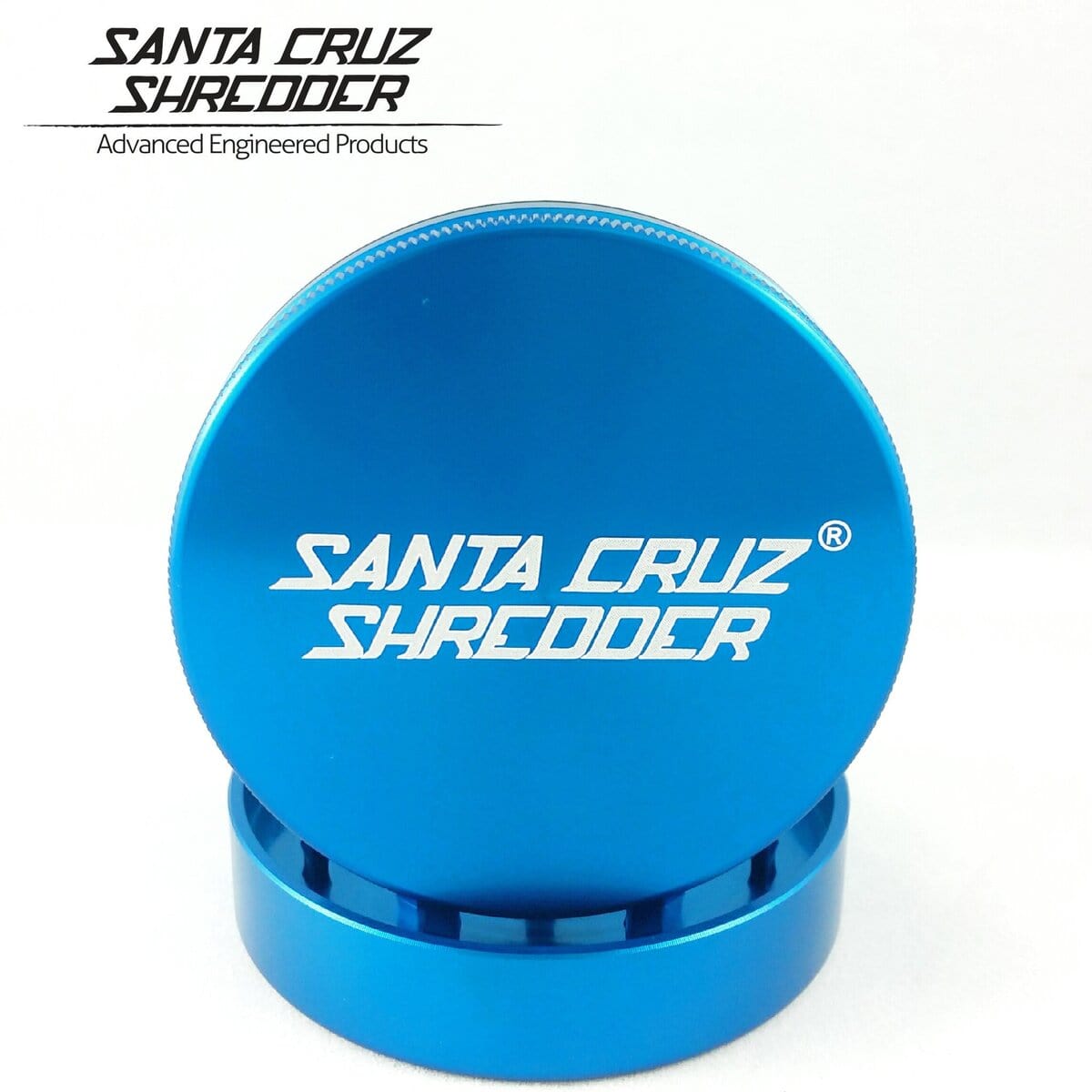 Close-up shot of the Santa Cruz Shredder 2 Piece Medium Grinder, showcasing its metallic blue finish and two-part design.