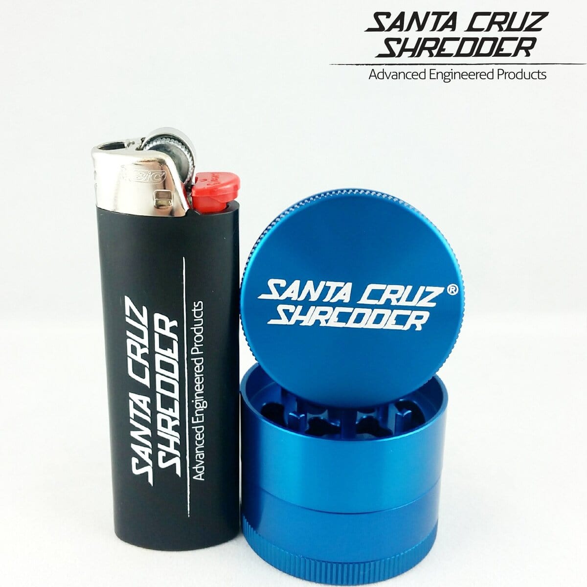 A close-up shows the Santa Cruz Shredder 4 Piece Mini Grinder with a metallic finish next to a lighter.