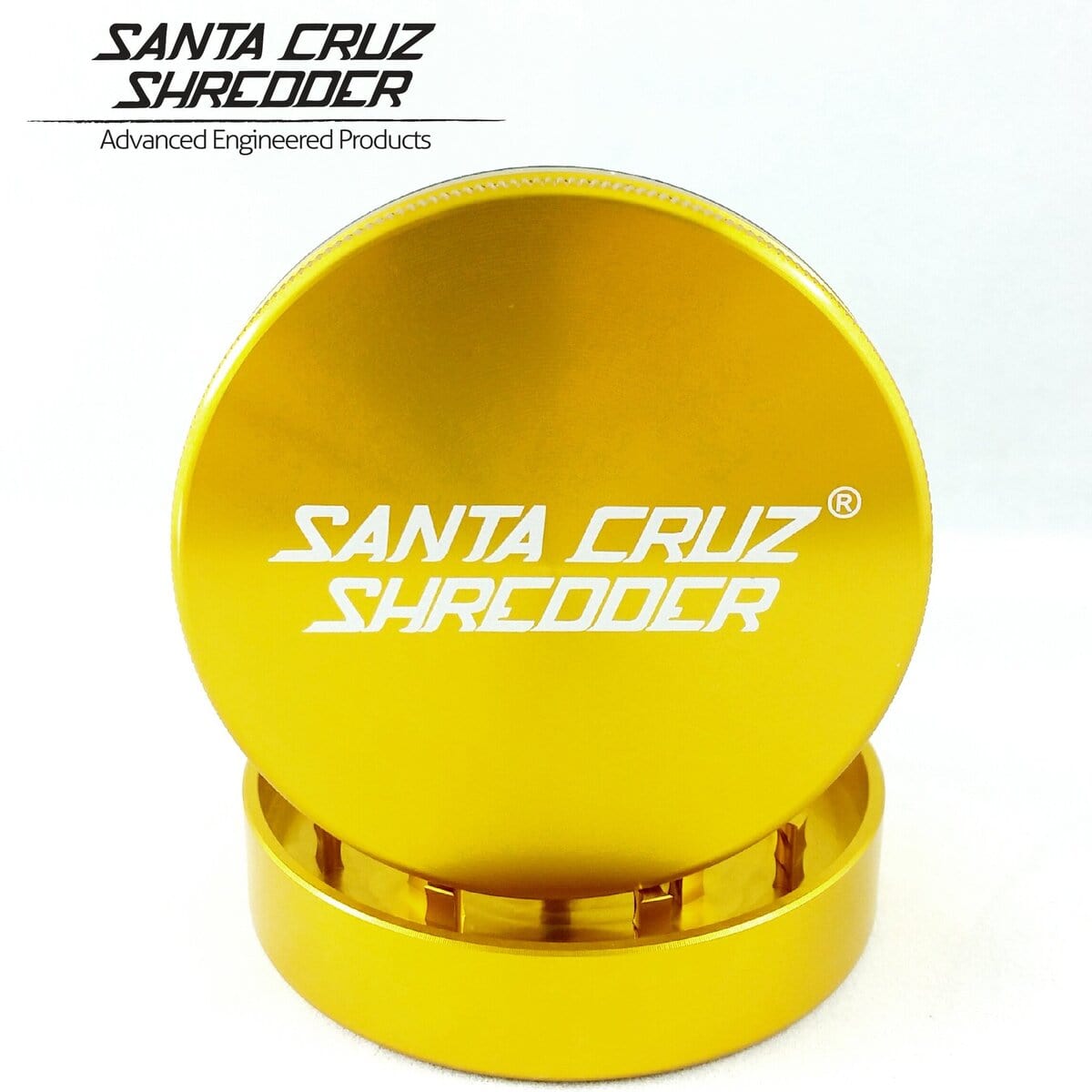 A close-up, angled view of the Santa Cruz Shredder 2 Piece Large Grinder, displaying its metal construction and two-part design.